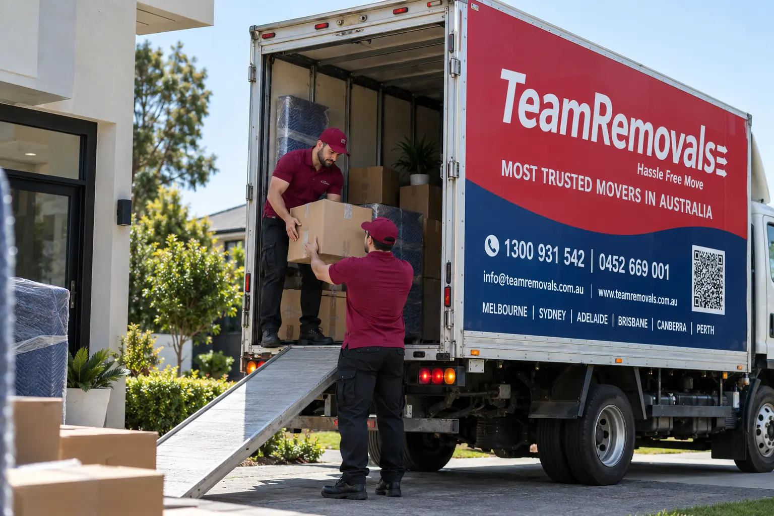Professional removalists loading furniture onto moving truck