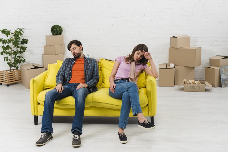 Couple awaiting furniture movers