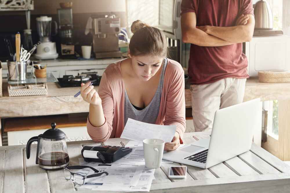 A Woman Calculating Utility Bills In Melbourne