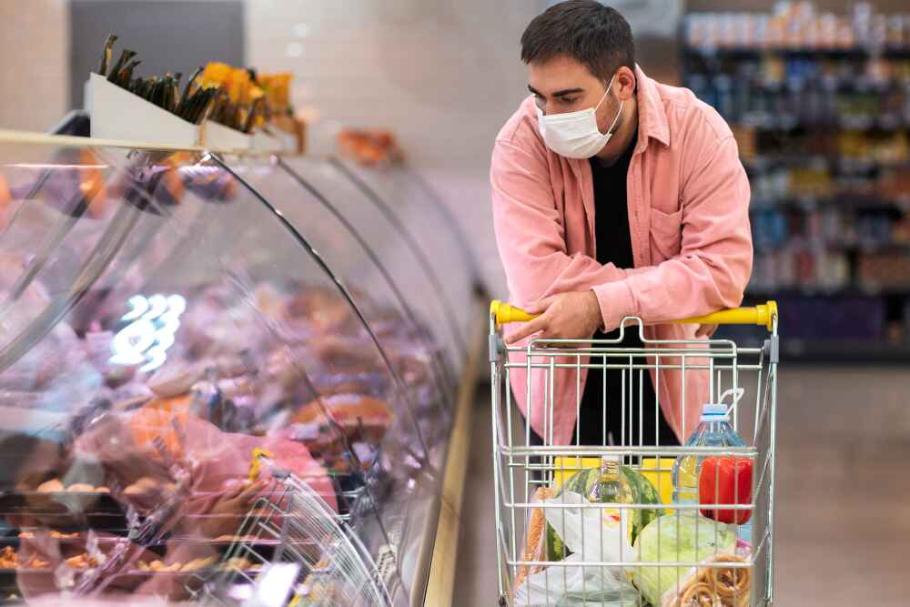 Man Thinking Whether to Buy Groceries In Brisbane 