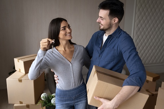 First Time Renter Packing Boxes Before House Move
