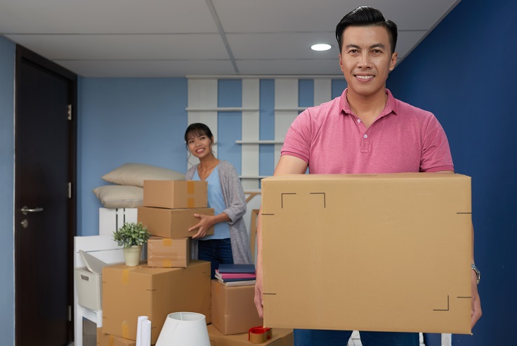Couple Preparing and Packing Boxes During an Interstate Move Couple Preparing and Packing Boxes During an Interstate Move